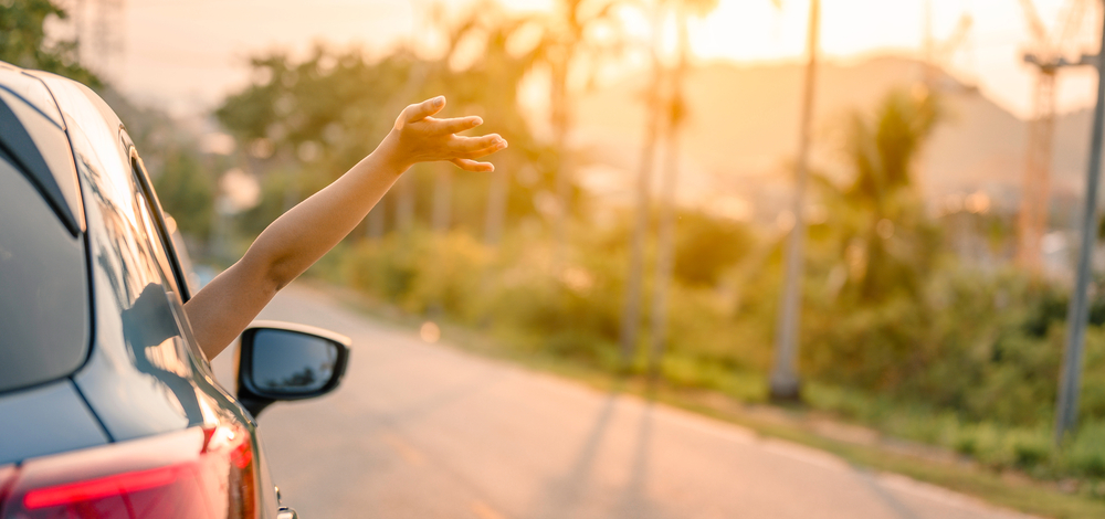 woman’s arm sticking out of a car window in the breeze | TCT Portal makes compliance assessments easier