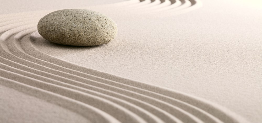 Stone in a Zen sand garden | take the stress out of compliance management