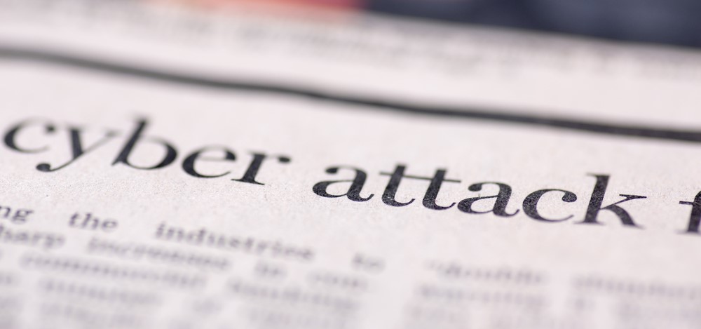 Newspaper headline “cyberattack” | cyber liability insurance