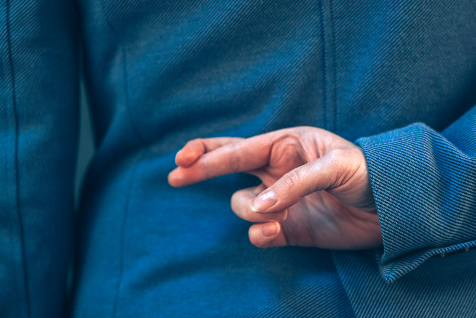 business person with fingers crossed behind the back | vendor security