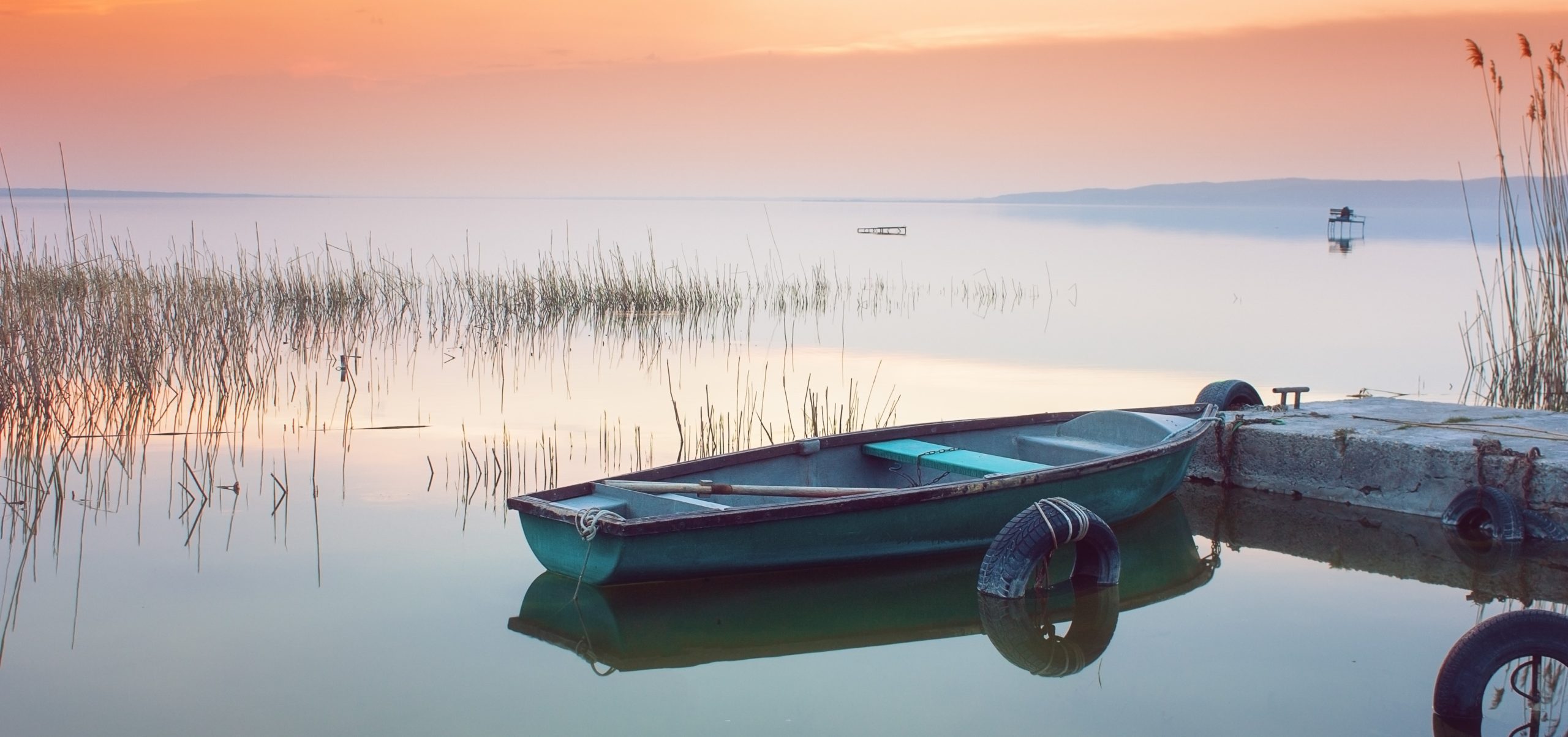 2 rowboats on a calm lake | Operational Mode Is a Low-Stress Way to Prepare for Your Annual Compliance Audit