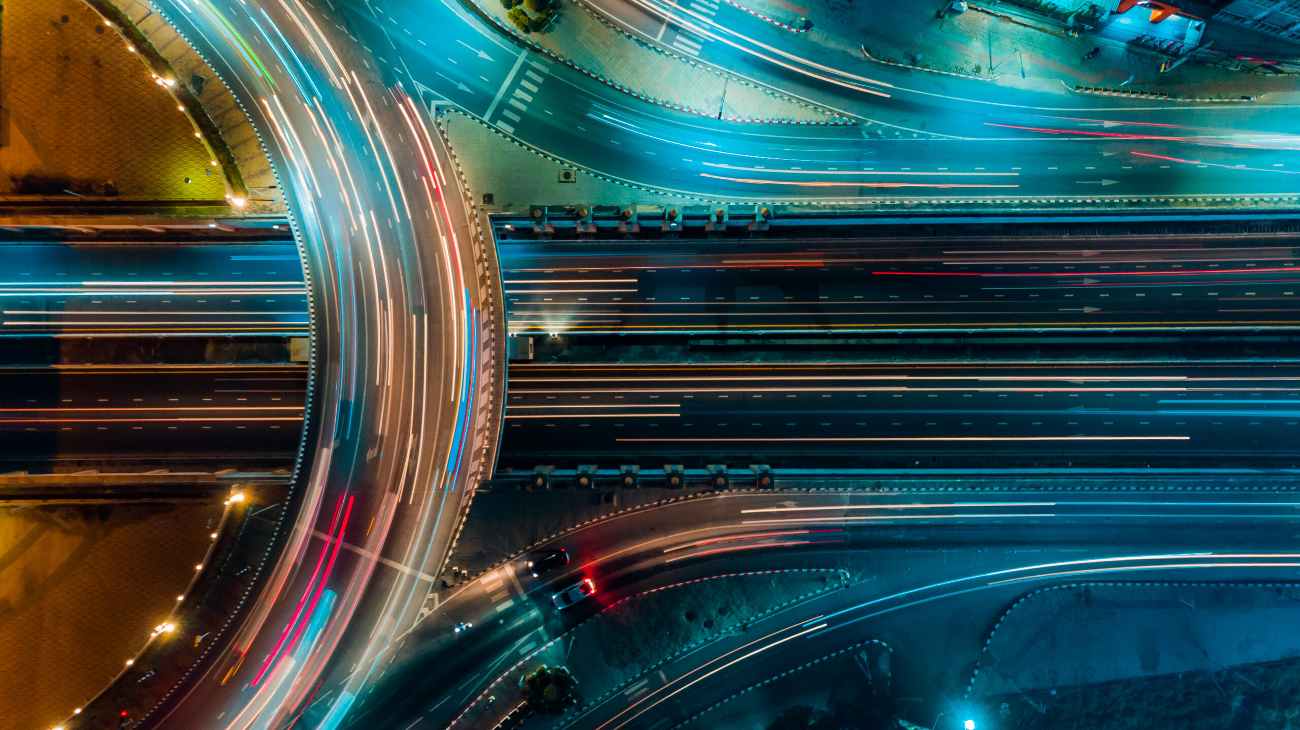 aerial view of traffic on a highway at night | build a compliance program