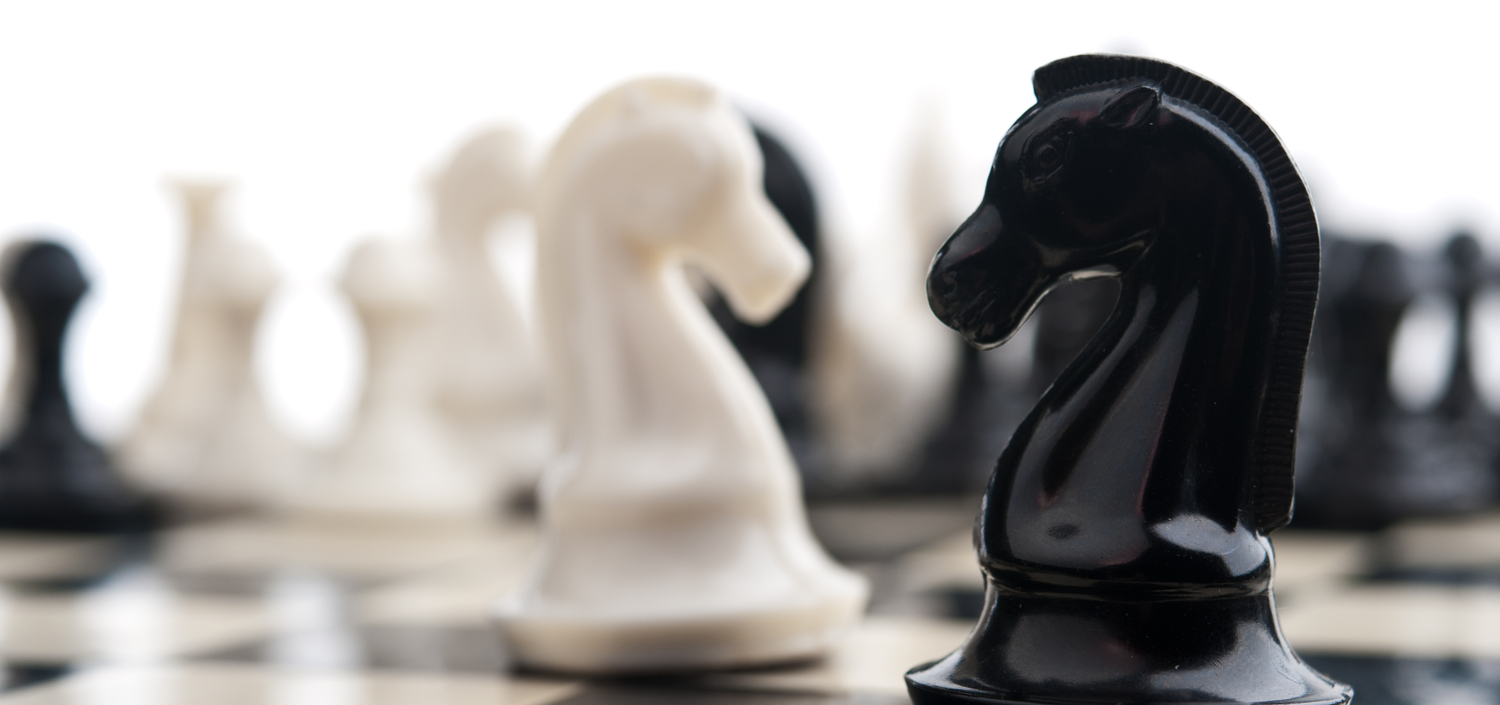 chess knights in a standoff | compliance spreadsheets vs. compliance management system