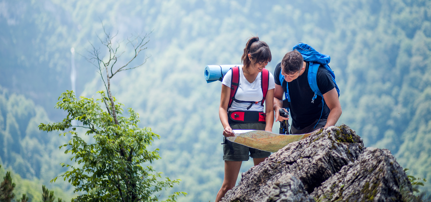 Hikers using a map to navigate | compliance in a post-COVID world | compliance unfiltered podcast