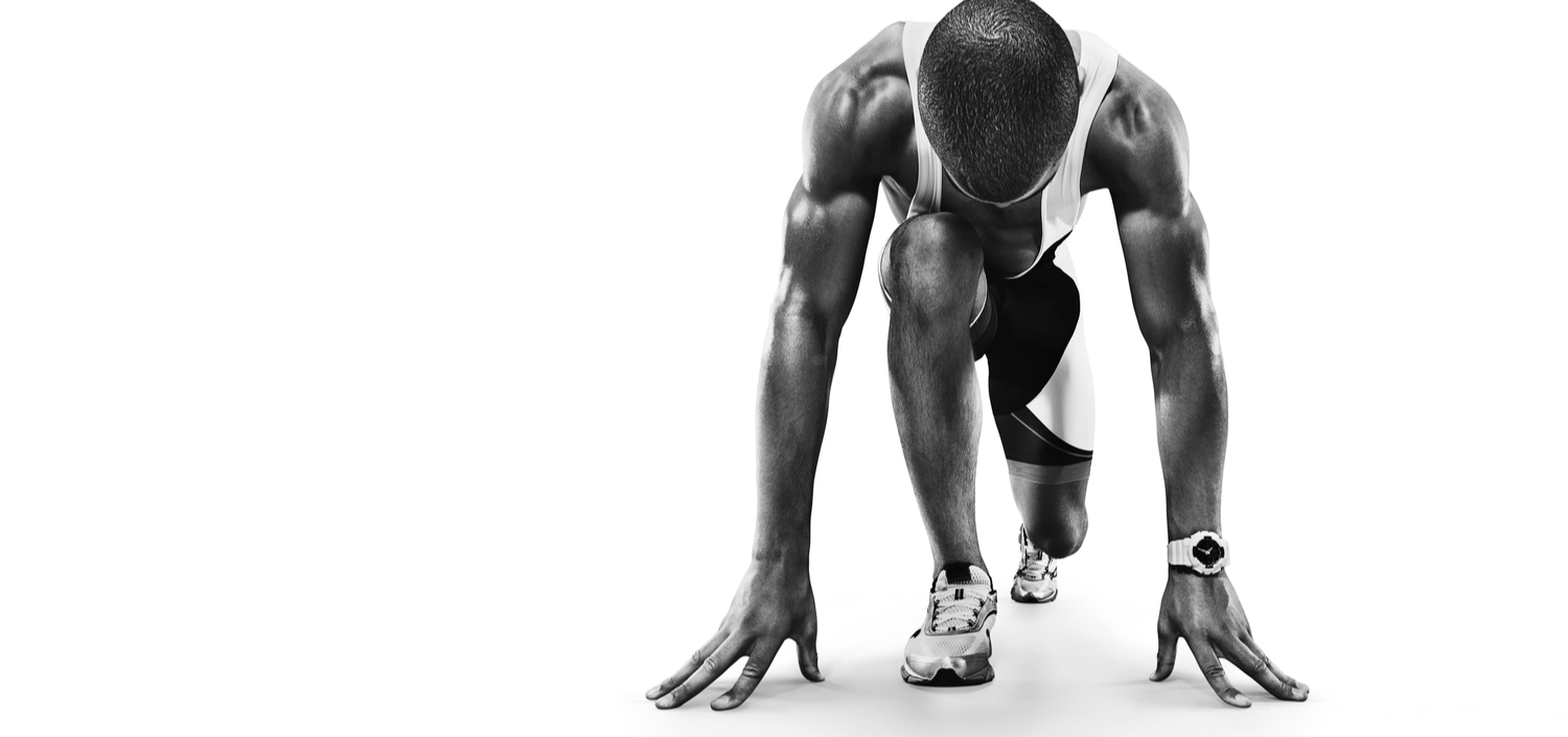 black and white image of a runner at the starting blocks, against a white background | best compliance management software