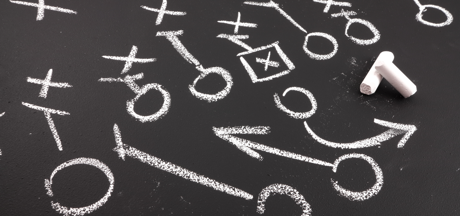 closeup of a football play on a chalkboard | planning for HIPAA compliance