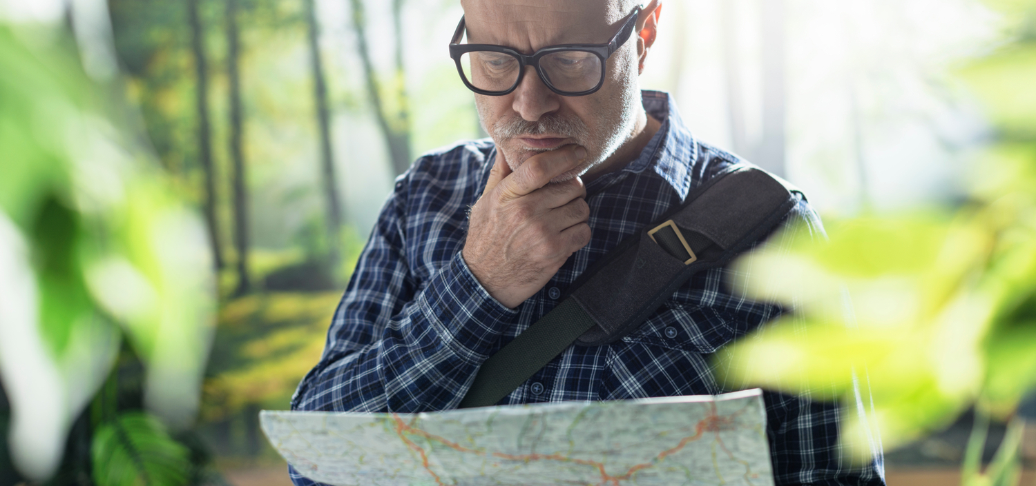 man lost in the woods and looking at a map | new certification you’ve never used before