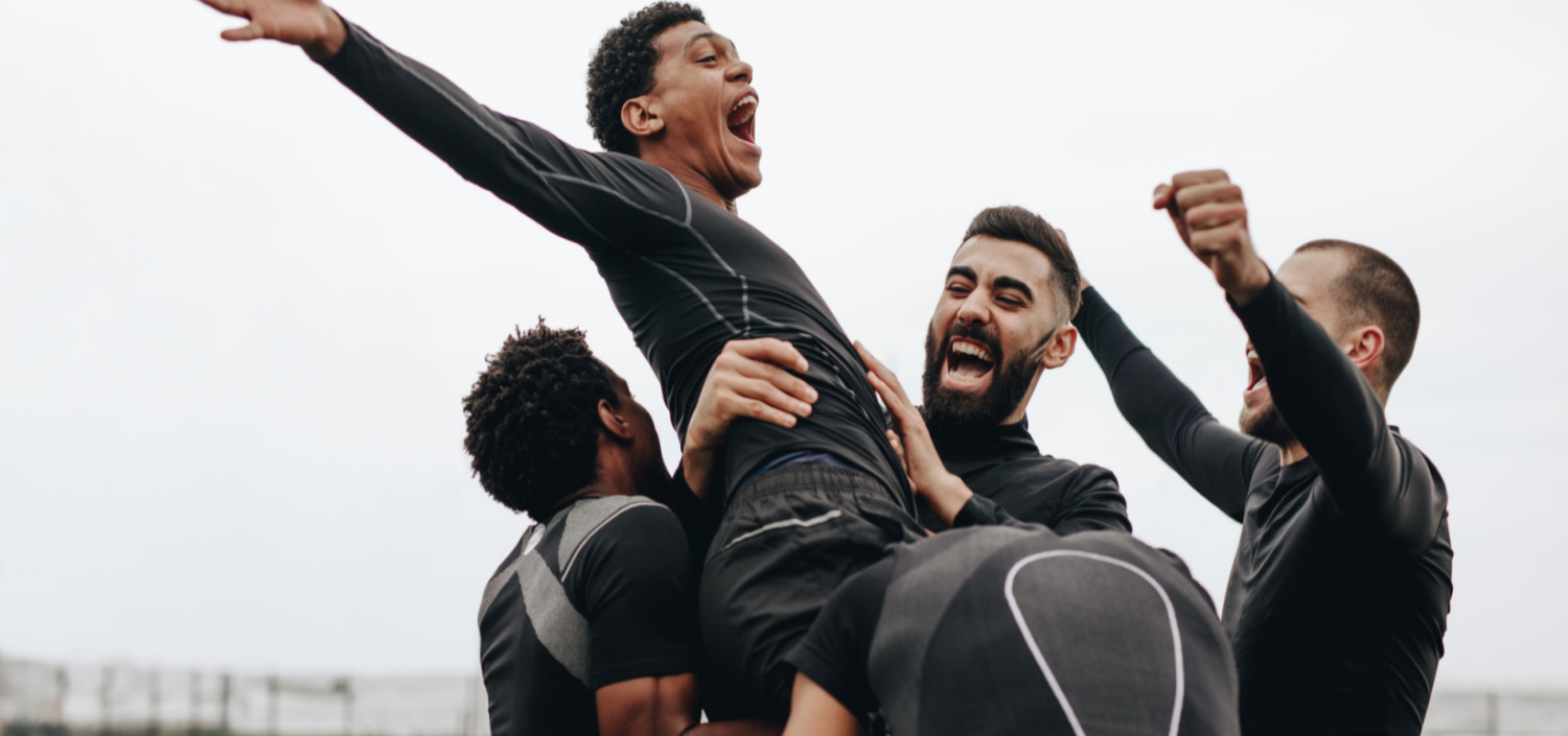 soccer team celebrating | equip your team for compliance success