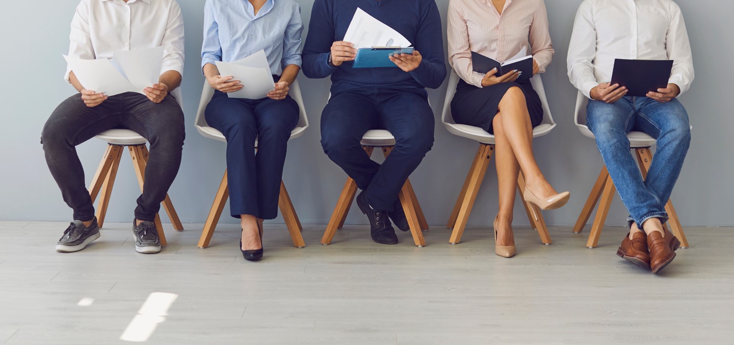 group of job candidates waiting in line for interview | employee turnover