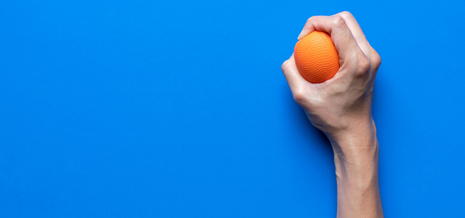 hand squeezing a stress ball | reduce compliance stress