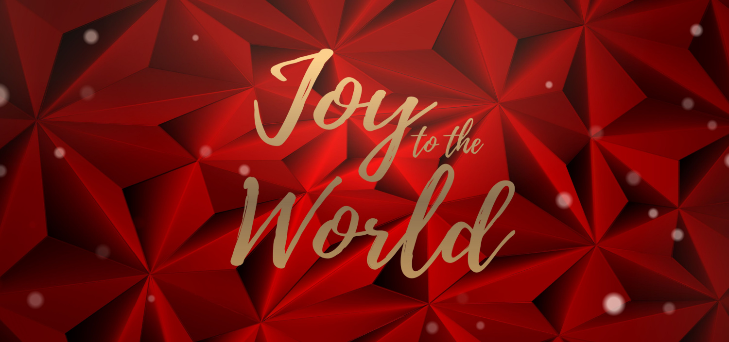 gold lettering on red background that says “Joy to the World”