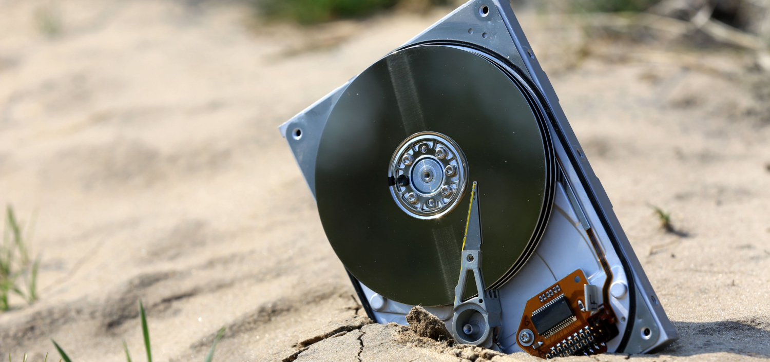lost hard drive on a sandy beach | Quick Compliance & Security Insights