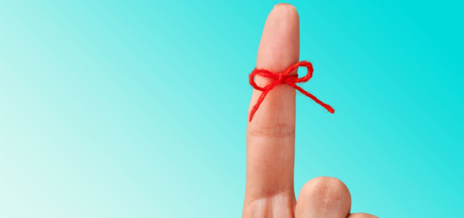 red reminder yarn tied around index finger | Quick Compliance & Security Insights