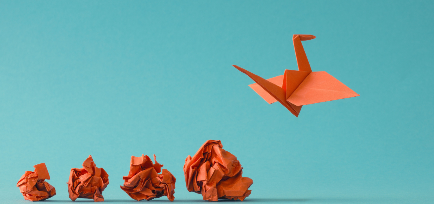 bird origami among crumpled balls of paper | TCT PCI conference