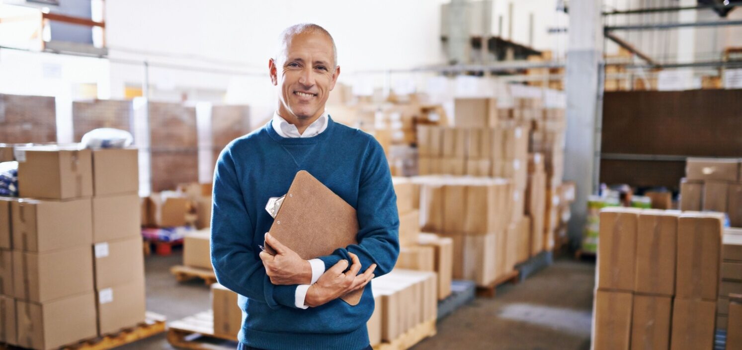 Retail manager smiling | How to End PCI Compliance Chaos in the Retail Industry