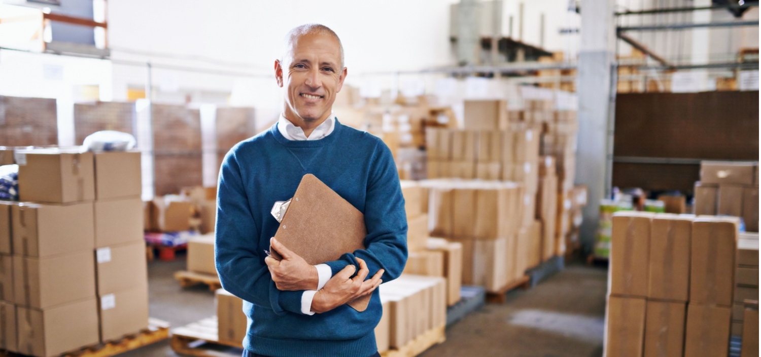 Retail manager smiling | How to End PCI Compliance Chaos in the Retail Industry