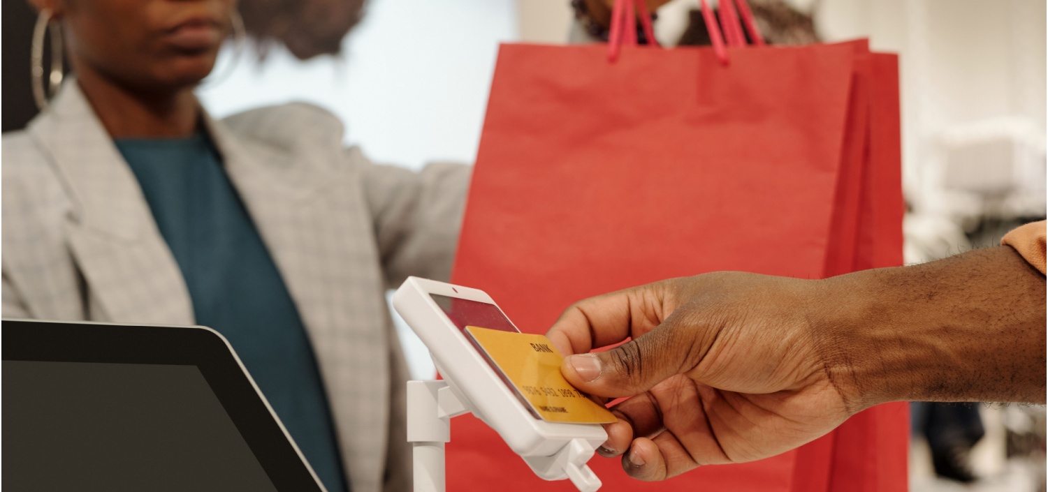 Hand of young male shopper applying credit card to payment | Holiday Shopping Season Means Cyber Threats for Retailers