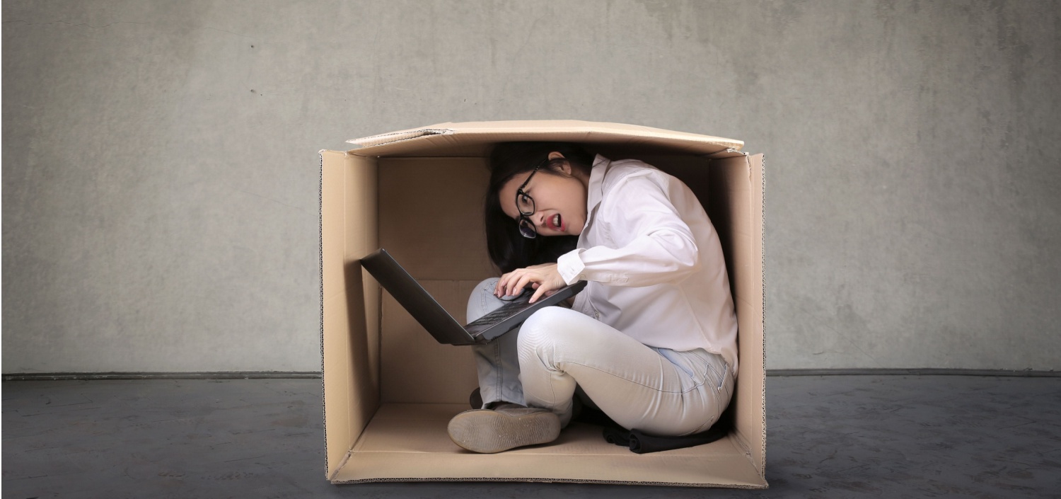 Business woman stuck in a small box | complex compliance management software