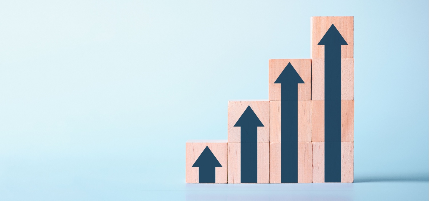 columns of wood blocks with arrows on them to represent automated compliance engagement scoping
